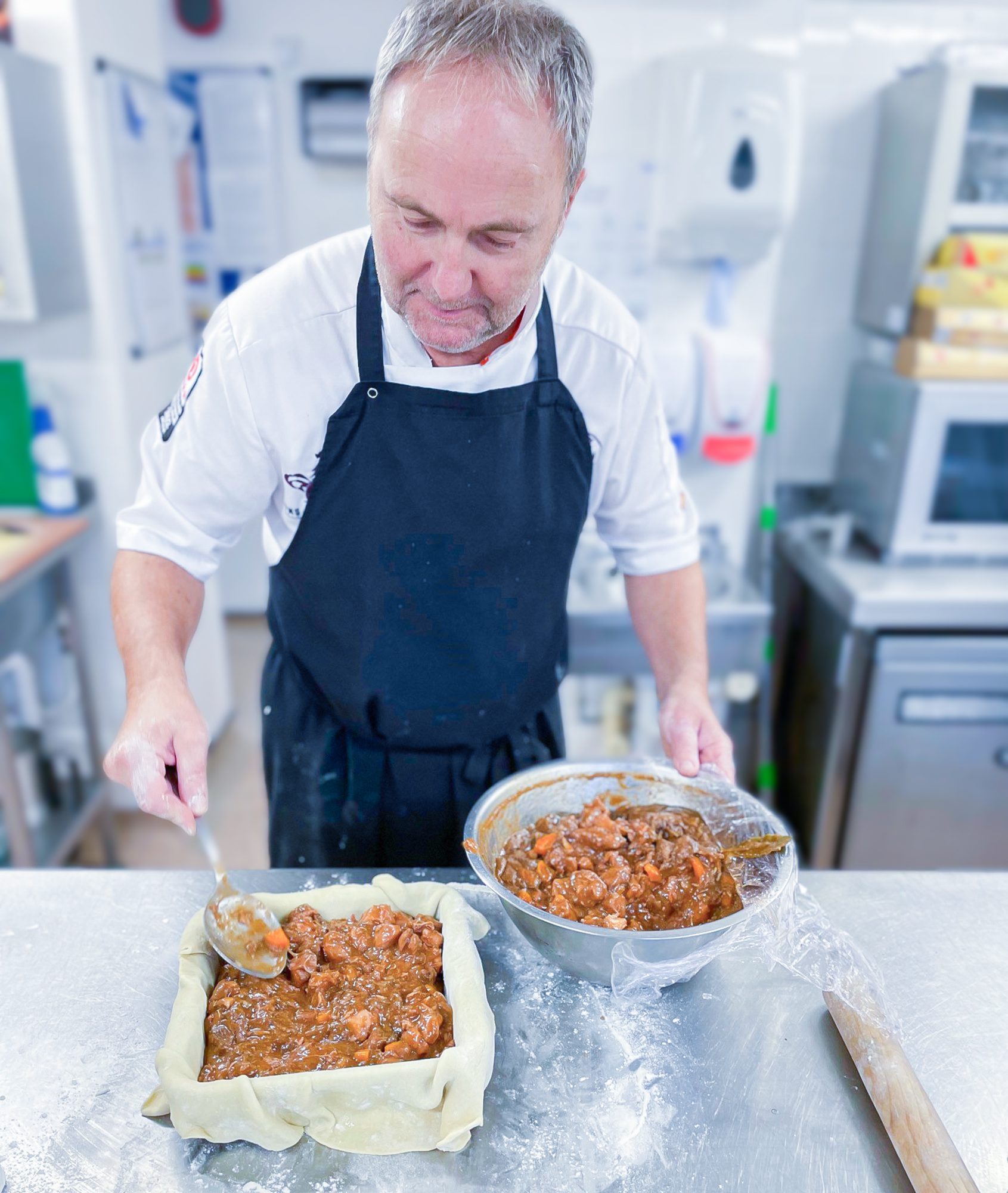 Chef Jim adding ingredients to the pie.