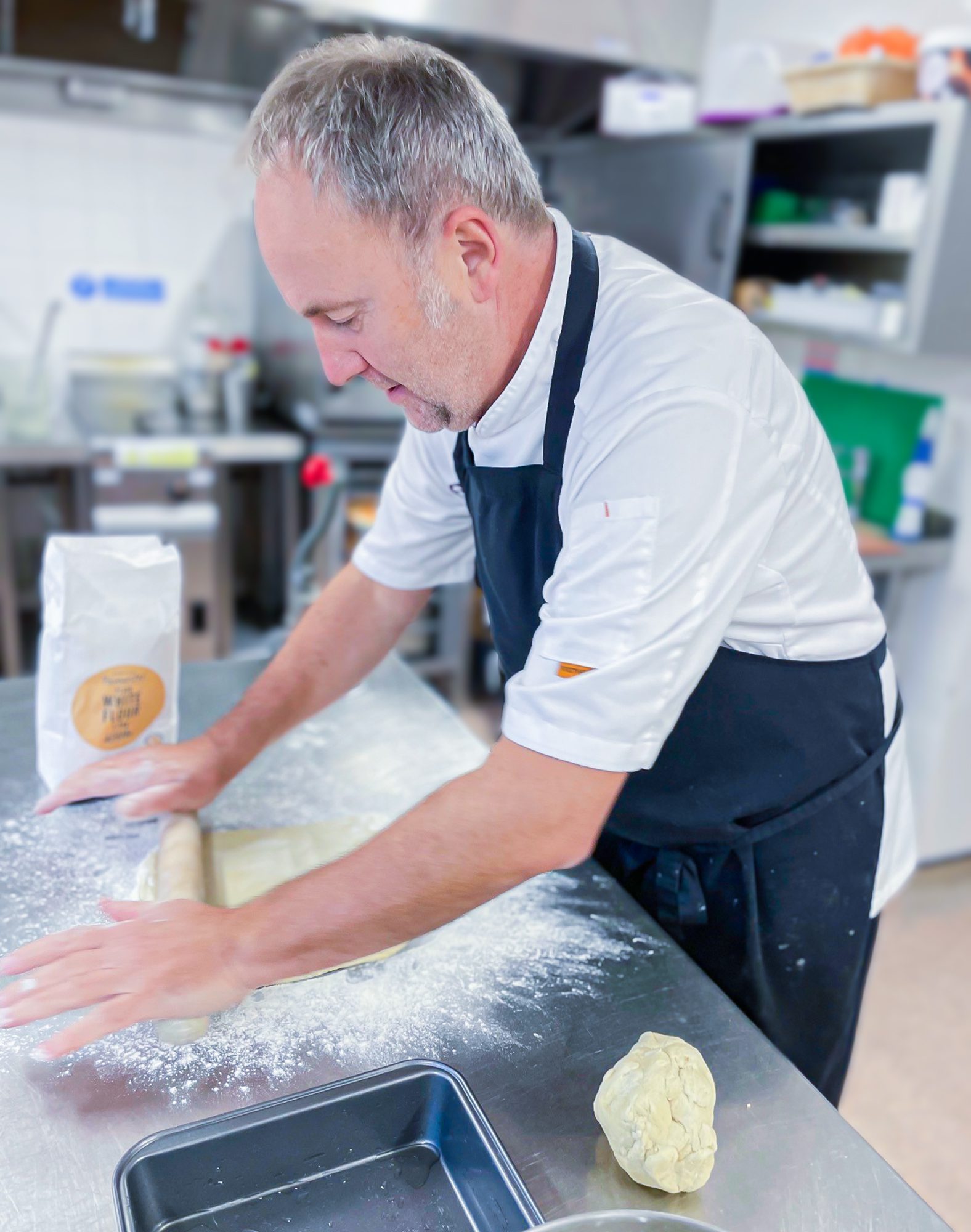 Jim rolling dough.