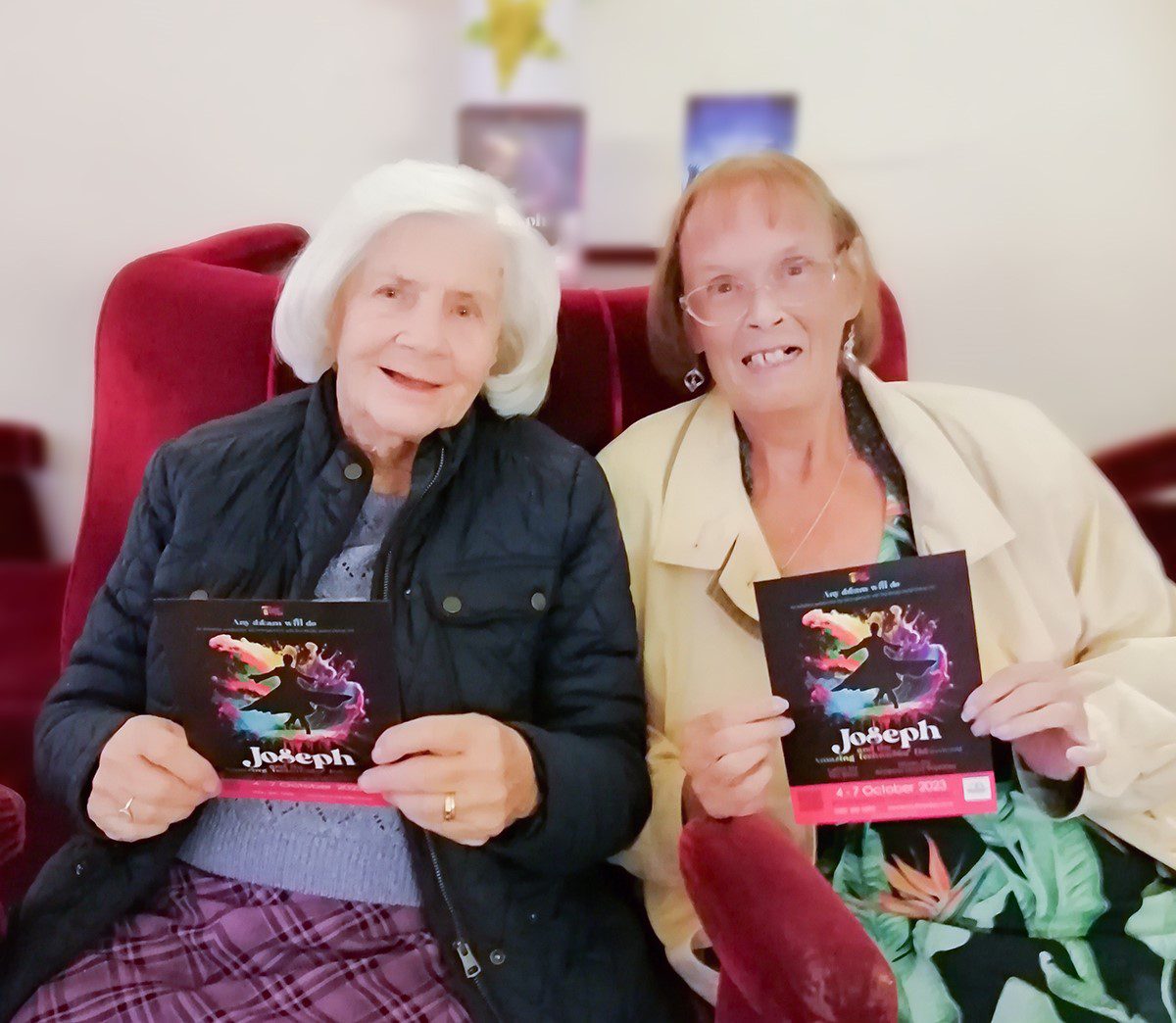Pauline and Barbara at the theatre holding the show's programme.