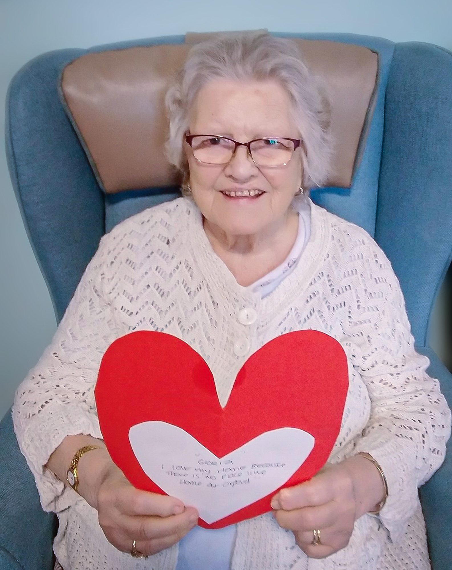 An Orford House care home resident holding her heart. 