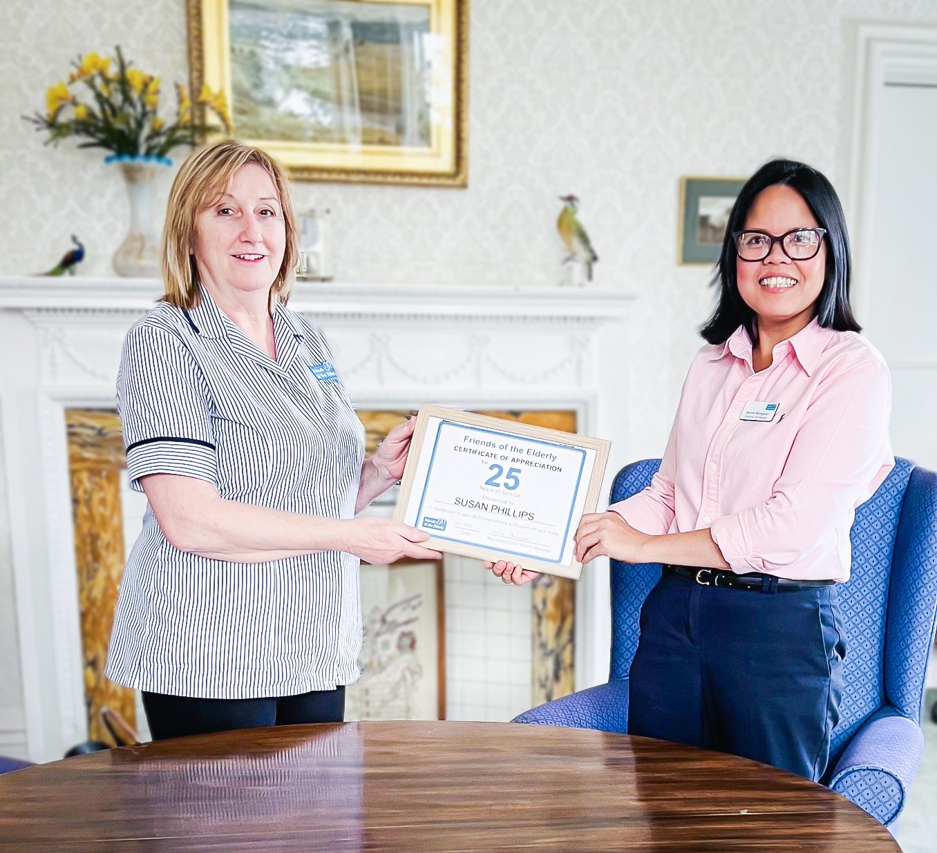 Susan receiving her Long Service Award at Davenham care home.