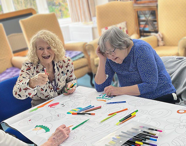 Susan colouring with Activities Coordinator Ann Essam.