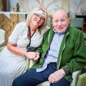 A resident and staff member enjoying Malvern's Wimbledon themed day. 