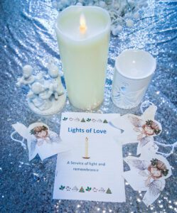 Candles and pamphlet from the service. 