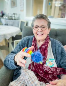 Eileen playing with a finger puppet. 