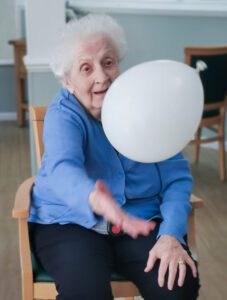 A resident playing with a balloon. 