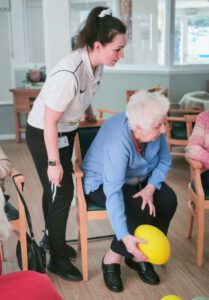 A resident and Rise staff member during the exercise class. 