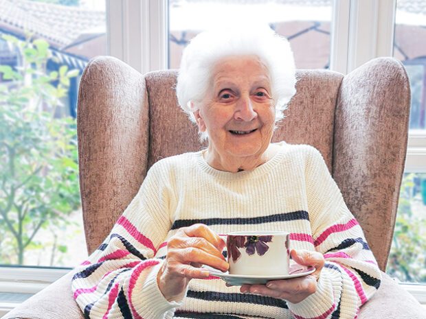 New Copford Place care home resident, Pat, enjoying a good cup of tea on National Tea Day