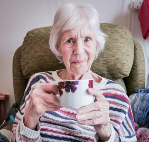 Sylvia Edwards, Resident at New Copford Place, our Essex care home, enjoying National Tea Day with a cup of tea.