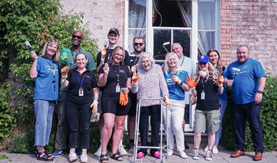Access Volunteering Team and Friends of the Elderly staff with resident Margaret Hampshire