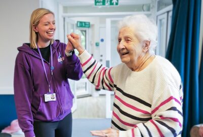 Libb and New Copford Place care home resident Pat dance together.